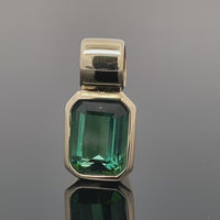 ANHÄNGER AUS 375/- GELBGOLD MIT GOLKONDA TURMALIN (CA. 1,10 ct.)